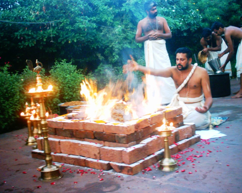 A homam, with lamps beside the sacred fire