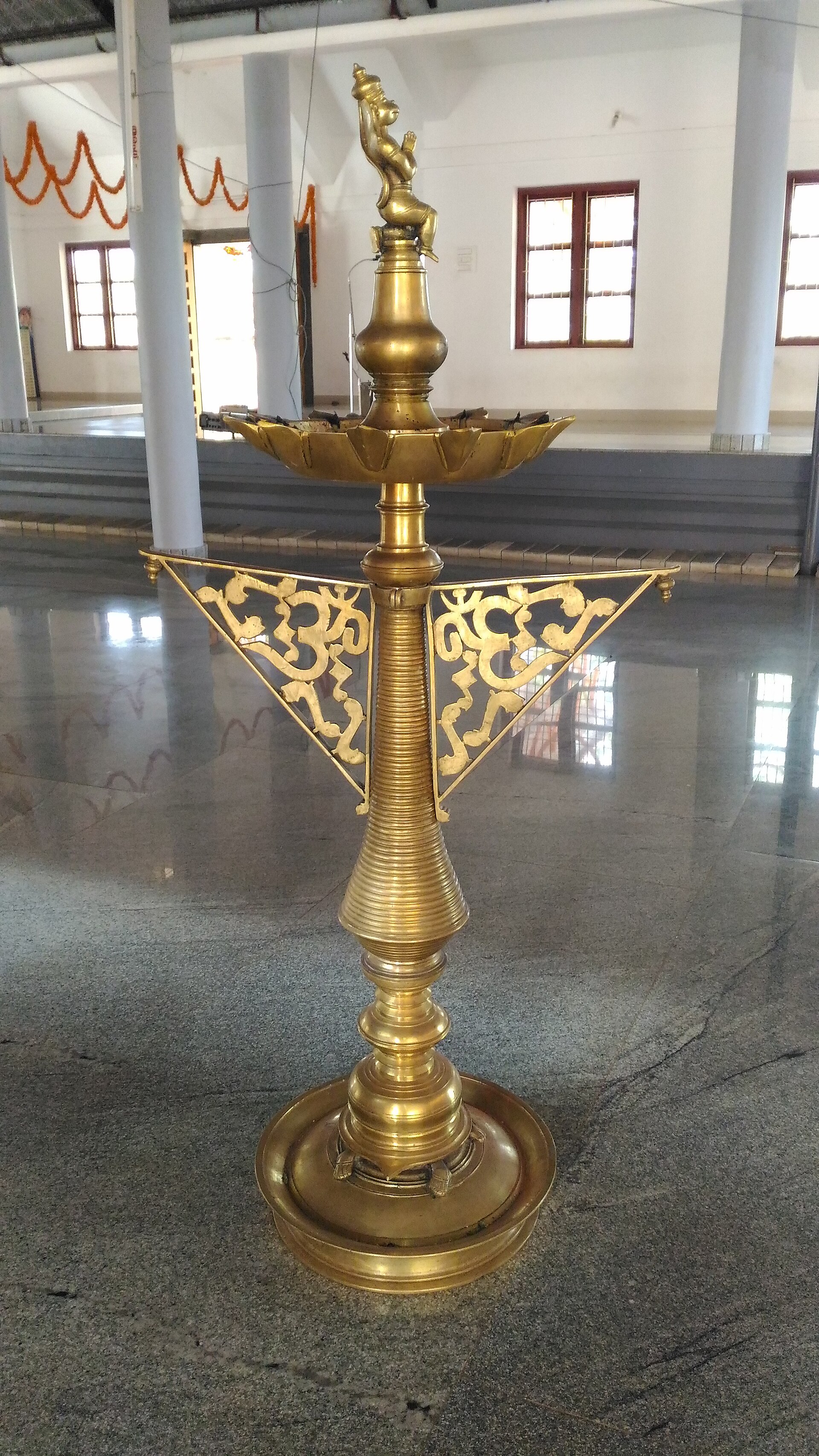 A brass nilavilakku
